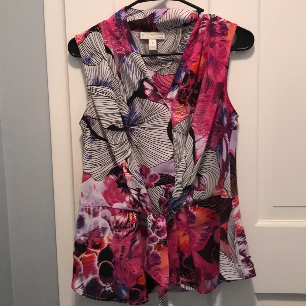 Sleeveless top with tie front waist.